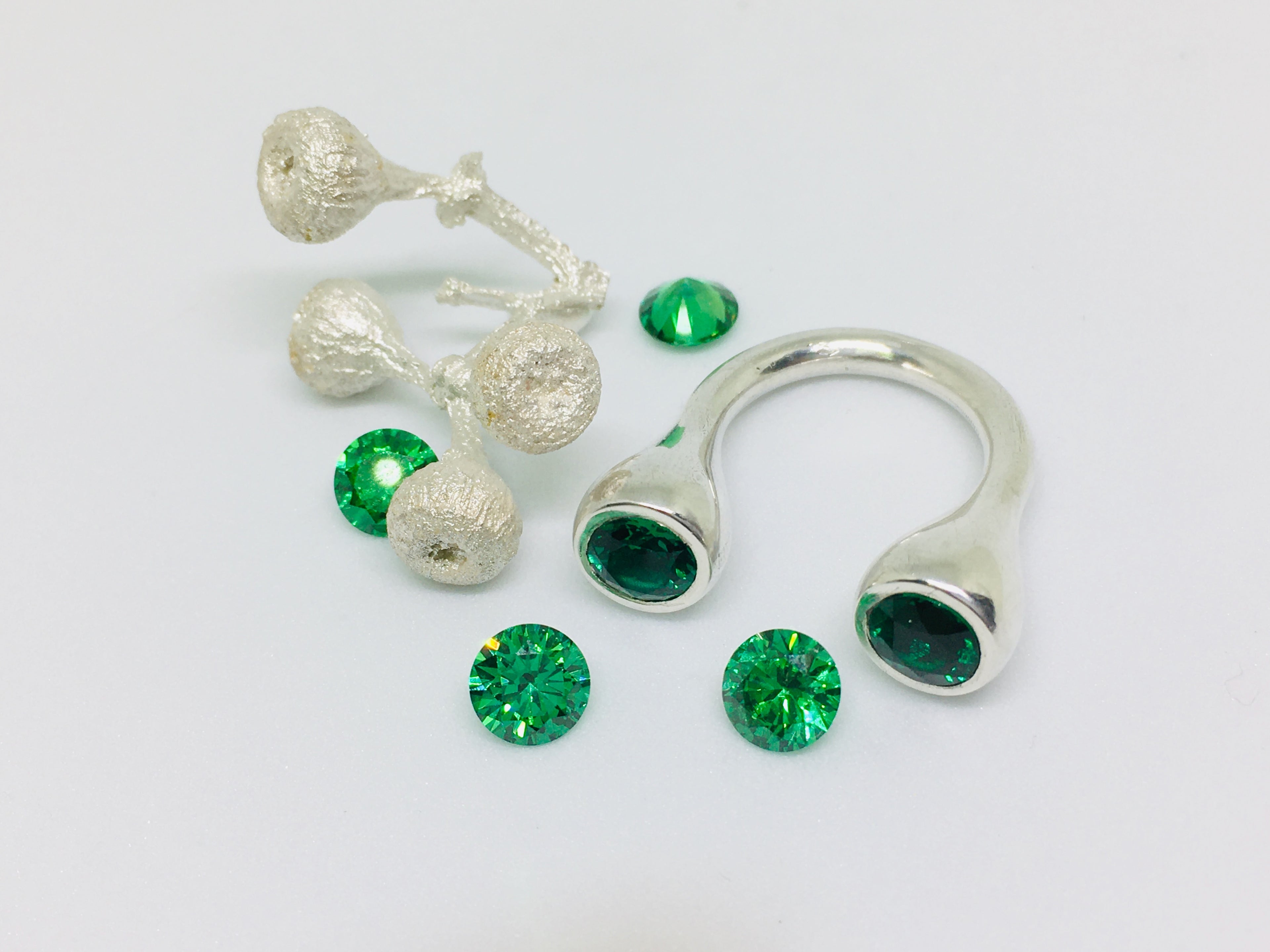 Crescent Stone Sterling Silver Ring with Green Emeralds