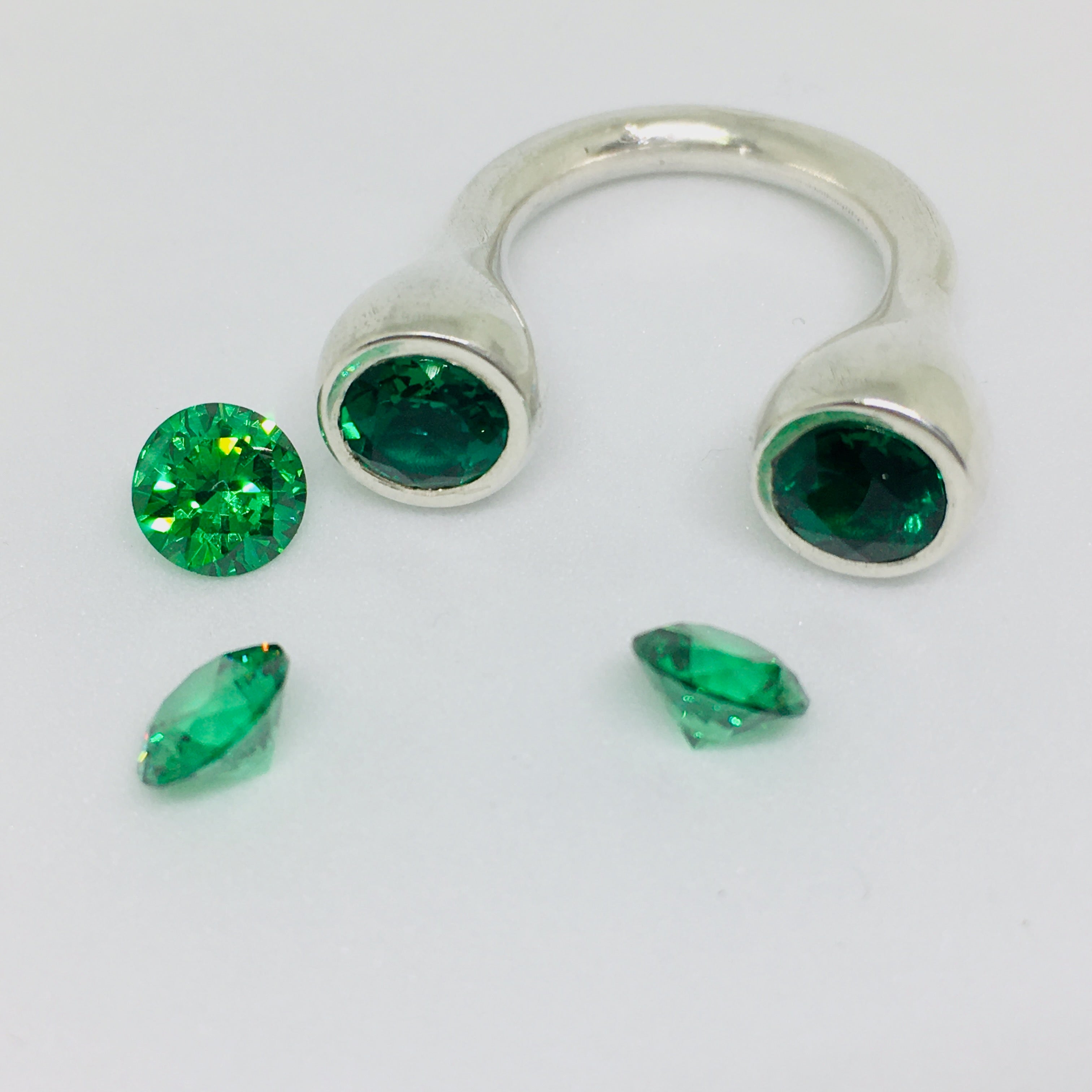 Crescent Stone Sterling Silver Ring with Green Emeralds